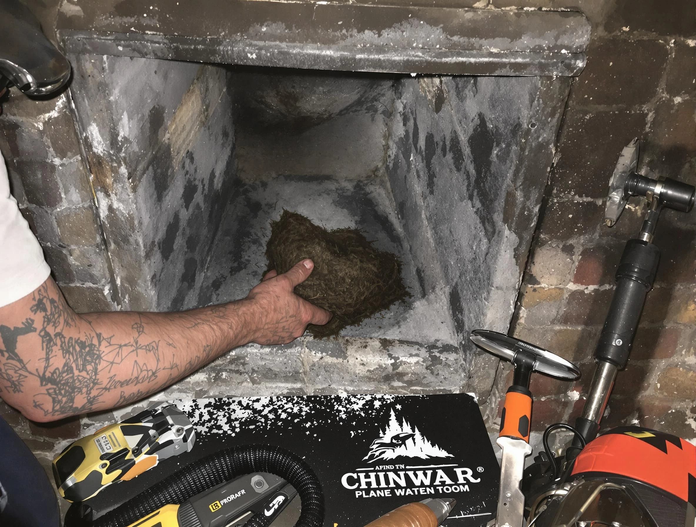 Marshall Chimney Sweep safely removing debris and screening chimney in Marshall, PA